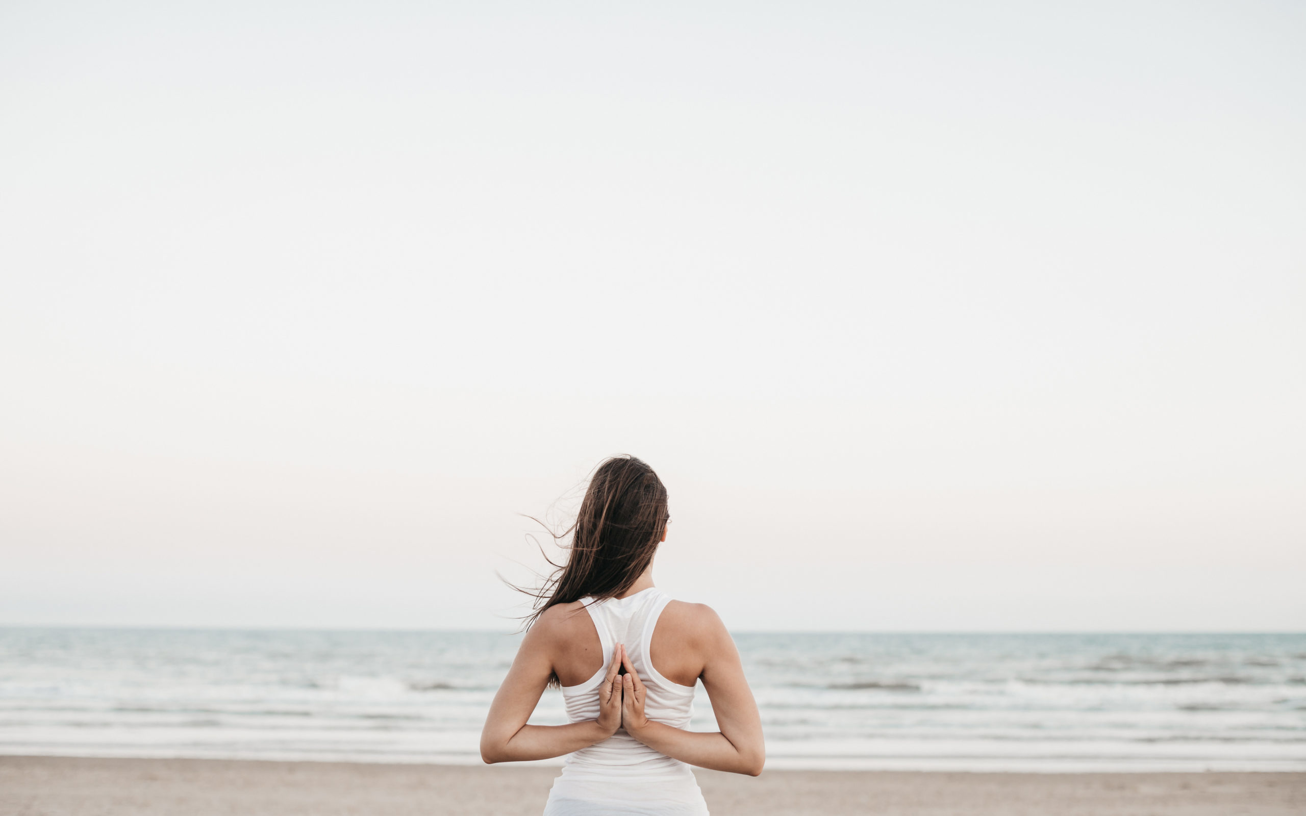 about yoga, reverse prayer, yoga at the beach, yoga teacher